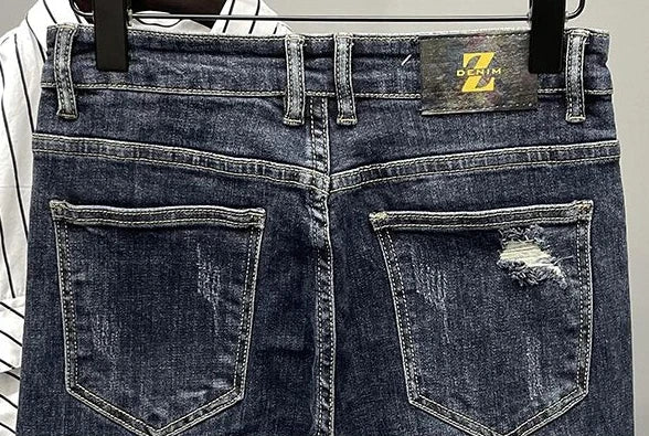 Jeans strappati strappati con stampa per uomo Pantaloni con fori grafici rotti Pantaloni casual morbidi Kpop eleganti pantaloni da cowboy da uomo larghi gotici regolari - StepByStep