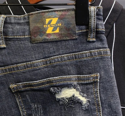 Jeans strappati strappati con stampa per uomo Pantaloni con fori grafici rotti Pantaloni casual morbidi Kpop eleganti pantaloni da cowboy da uomo larghi gotici regolari - StepByStep